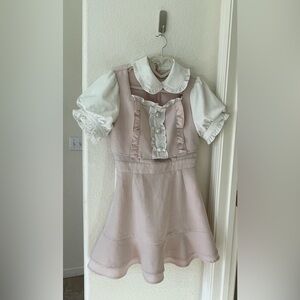 Ank Rouge medium length dress with short ruffle sleeves and pearl buttons